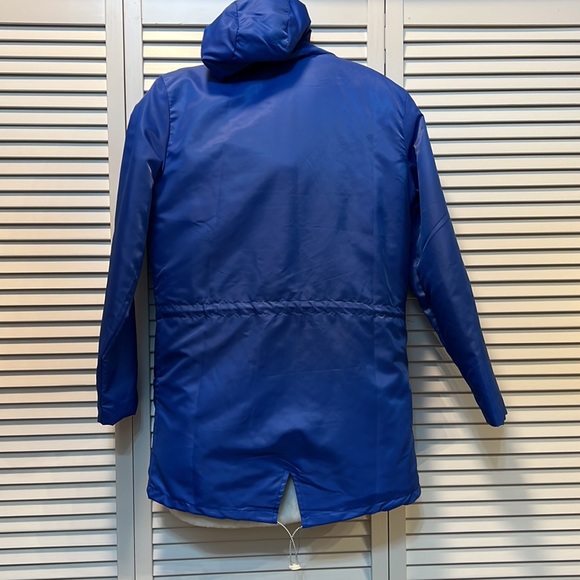 Rain jacket - blue.  Never worn.  Size M runs SMALL.  Drawstring waist and hood - Picture 2 of 7